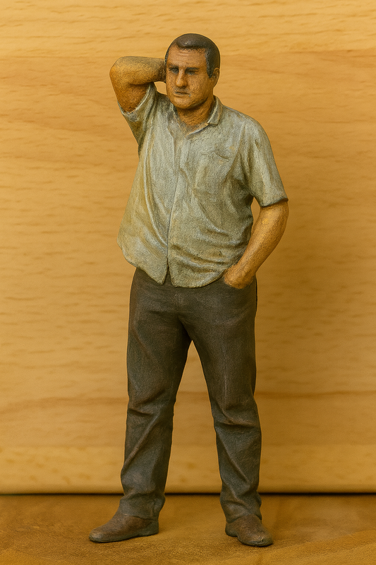 Model Statue of a man with a serious expression on a wooden background