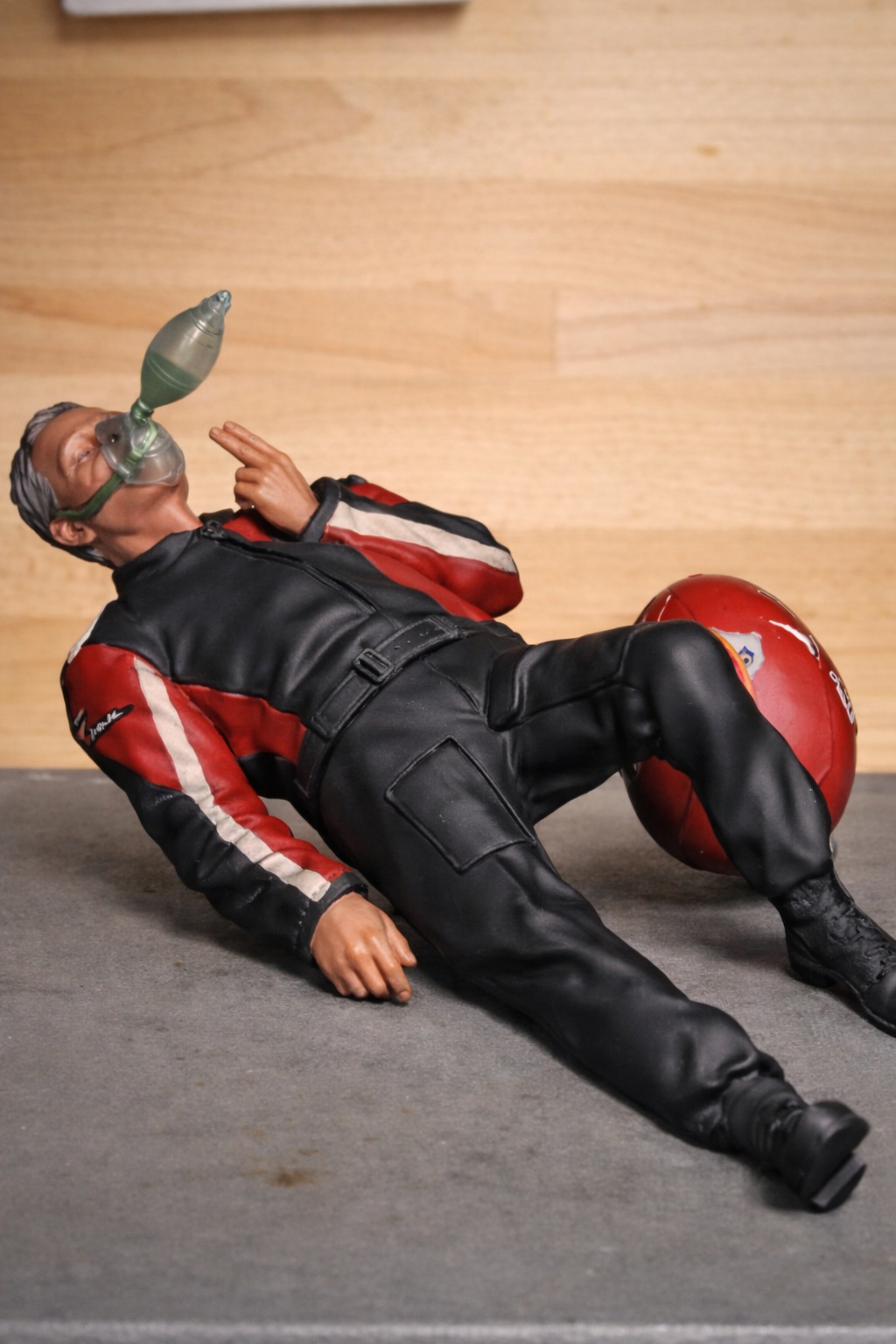 EMS28C Unpainted Injured Motorcyclist Casualty Lying Down with Helmet