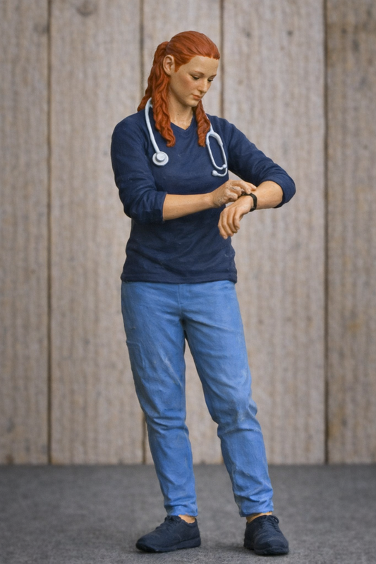 EMS29 – Scale Model Figure Unpainted Female Paramedic Checking Watch