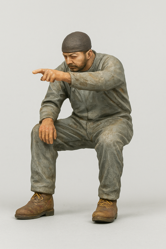 TG49 – Scale Model Ship Crewman Figure – Seated, Pointing, Grumpy Expression